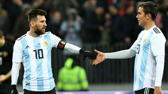 Paulo Dybala and Nahuel Molina celebrate Argentina’s World Cup victory with Lionel Messi
