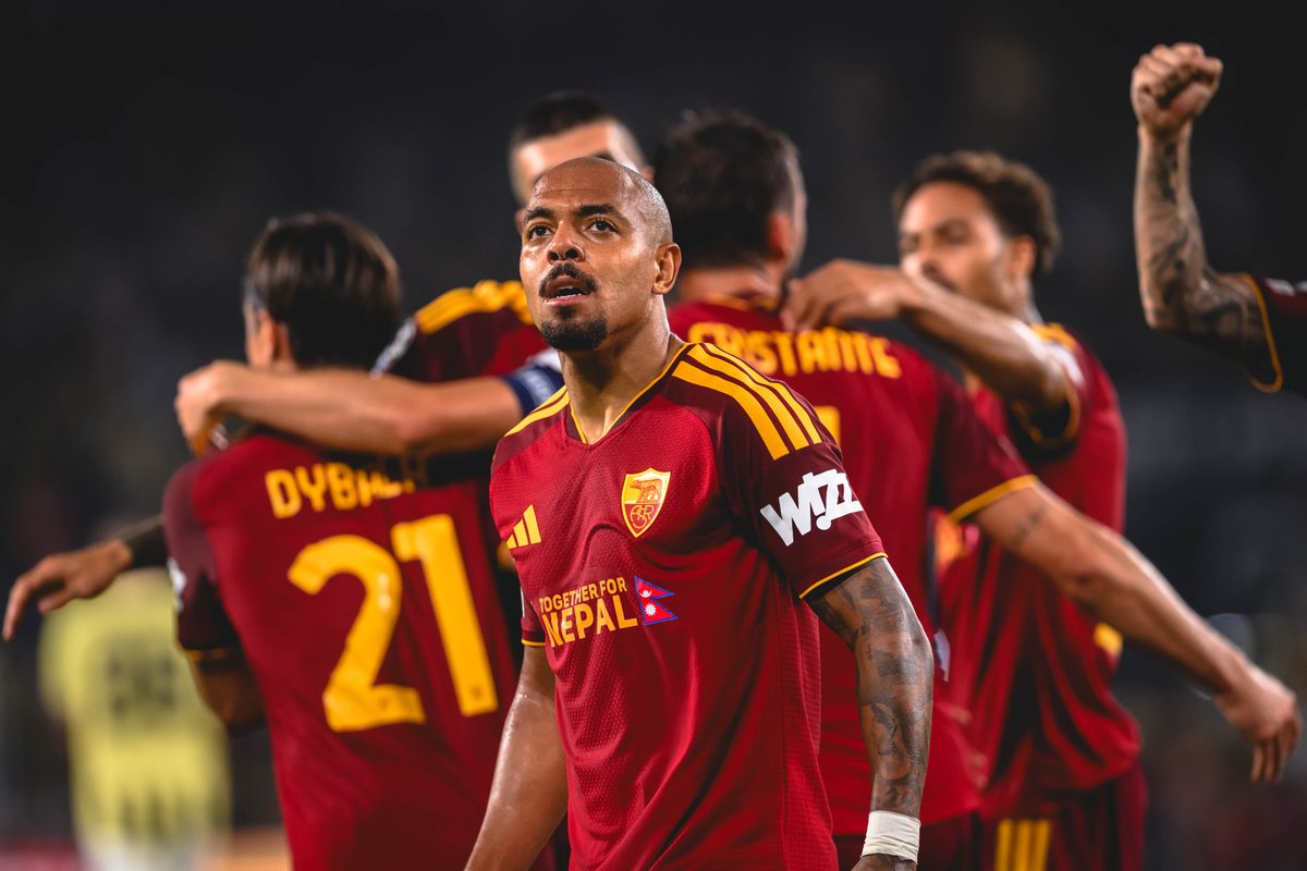 Roma and Torino players competing during a Serie A match